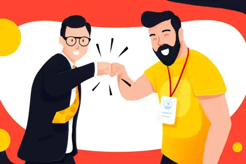Dwóch mężczyzn w garniturze i żółtej koszulce wykonuje "fist bump" na tle czerwono-białym z żółtymi kołami.